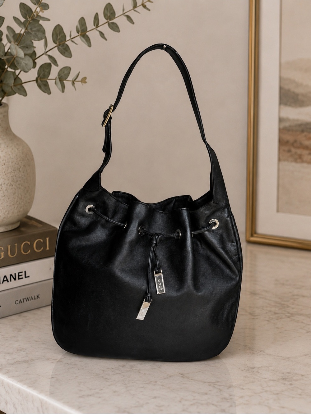 Gucci Black Leather Drawstring Hobo Bag crafted in supple black leather